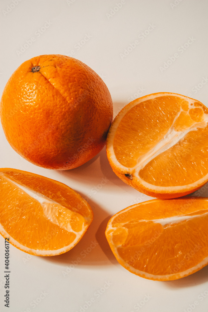 Whole and sliced orange on a background Whole and sliced orange on a background