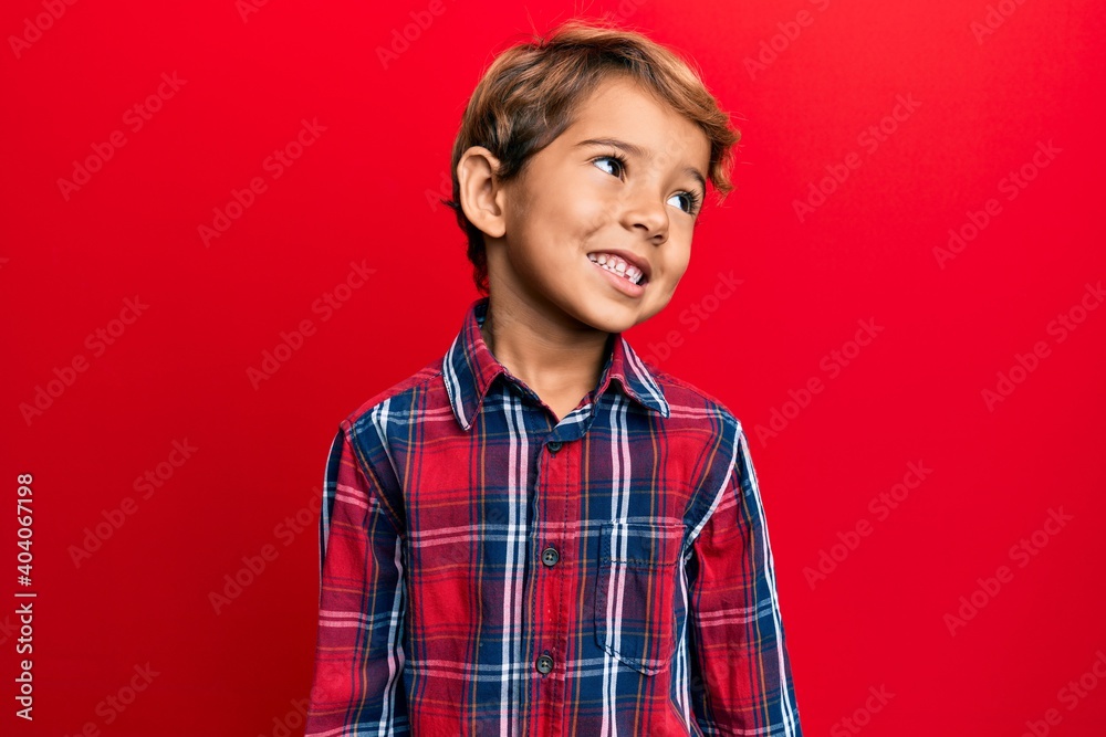 Adorable latin kid wearing casual clothes looking to side, relax profile pose with natural face and confident smile. Adorable latin kid wearing casual clothes looking to side, relax profile pose with natural face and confident smile.