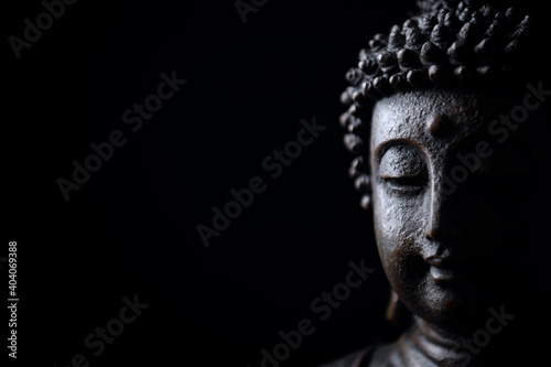 Wallpaper Mural  Meditating Buddha Statue isolated on black background. Copy space. Torontodigital.ca
