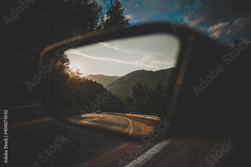Mirror view of uphill road in the Rocky Mountains
