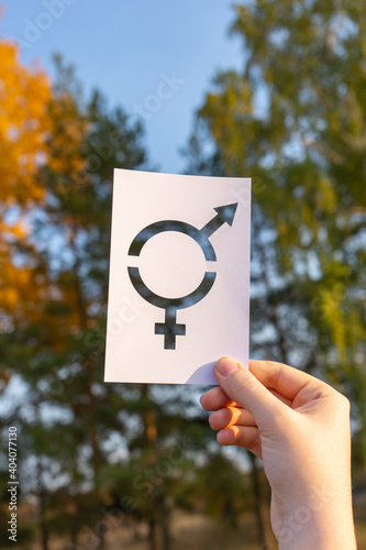symbol of gender equality on the background of autumn trees