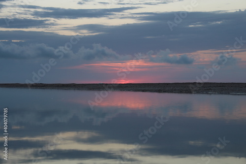 pink sunset on the coast of the river © Anastasia Bondarenko