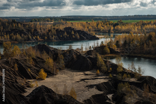 Turquoise quarry at Romantsevo, Konduki,. Tula region, Russia. Extraction of coal. Autumn landscape