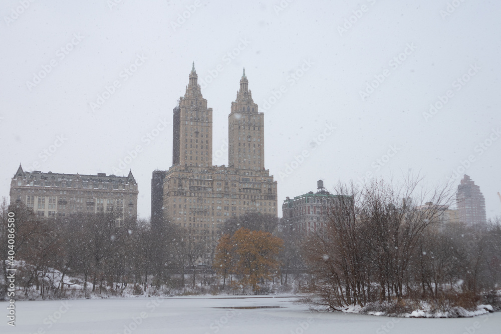 The Lake at Central Park during a Winter Snow Storm with the Upper West Side Skyline in New York City