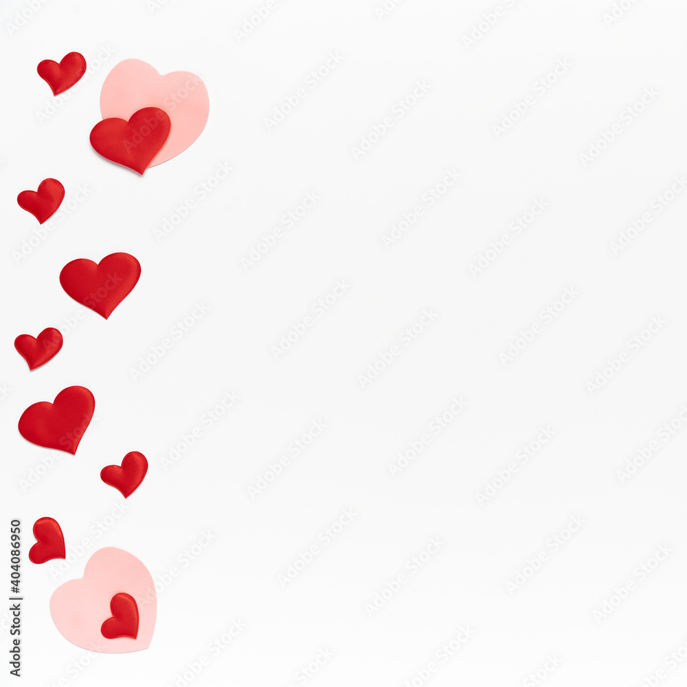 Flat lay, top view. Many little colored hearts on white isolated background. Template of Valentine day with place for text