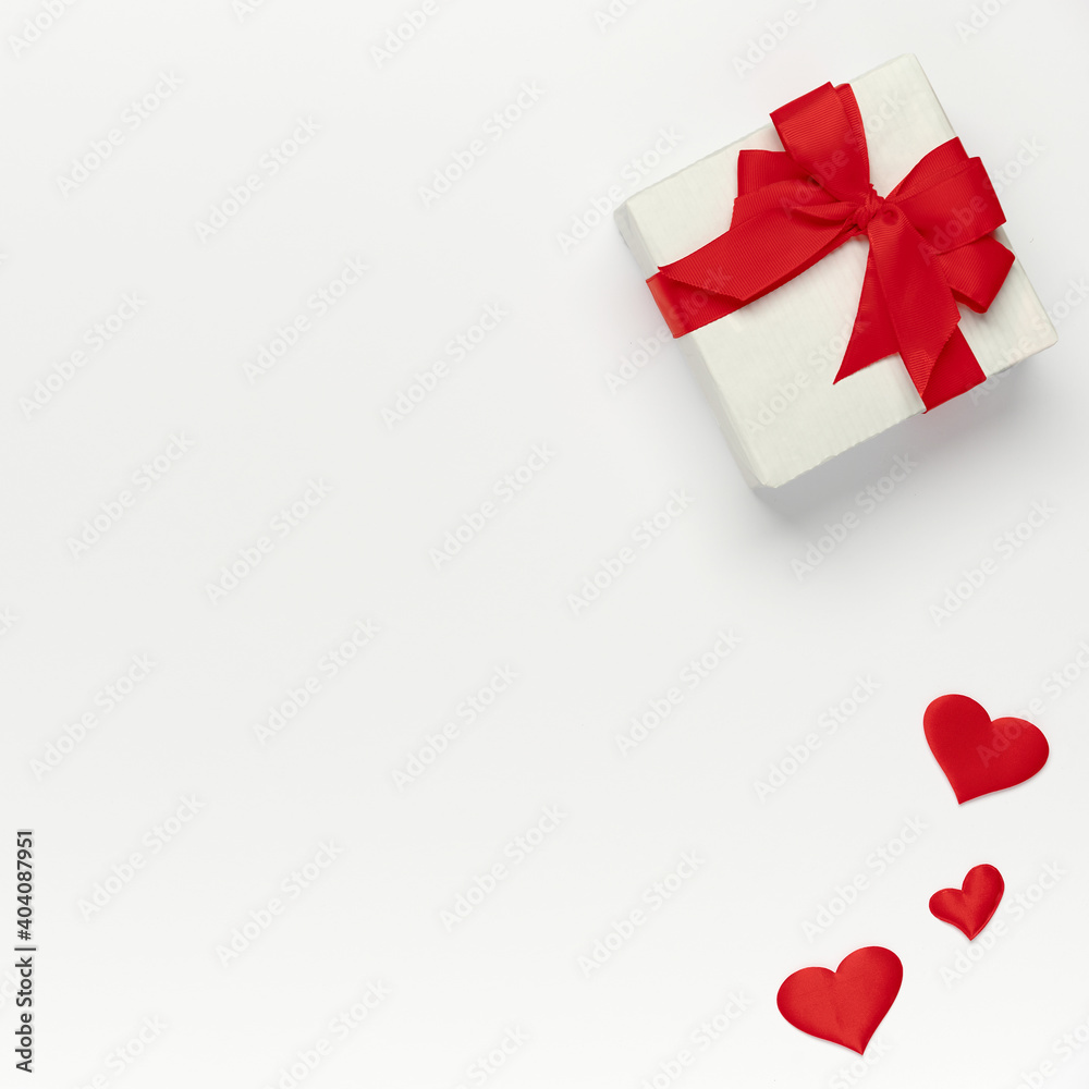 Saint Valentine concept, top view of colored hearts and gift box on white isolated with place for text background