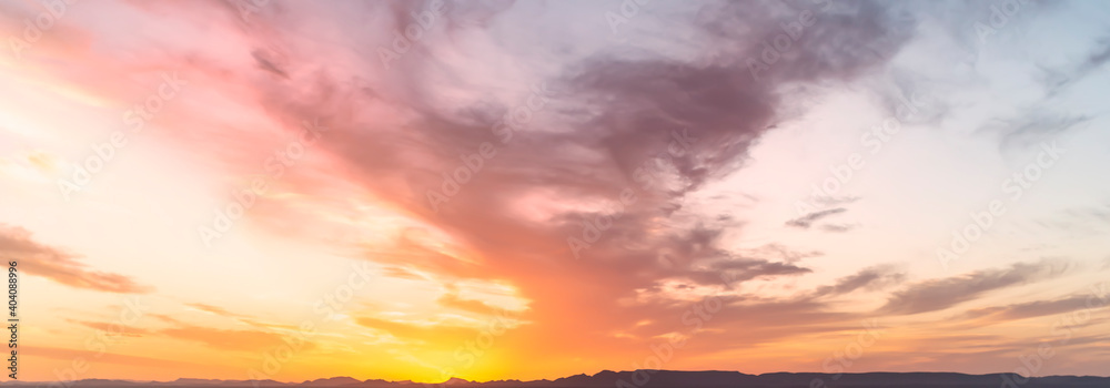 Stunning view of a dramatic sky with clouds at sunset. Natural background, wallpaper or preset with copy space.