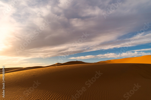  Selective focus  Stunning view of some sand dunes illuminated at sunset. Merzouga  Morocco. Natural background with copy space.