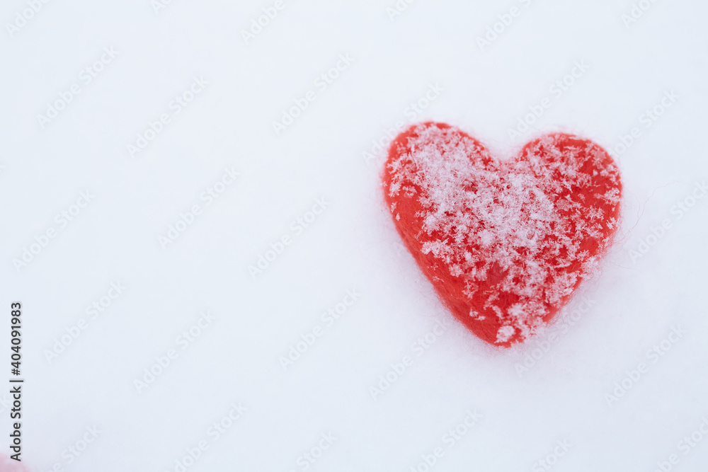 Valentines Day background with hearts. A pair of vintage decorative heart sticking out of the snow surface. Valentines Day background with hearts. A pair of vintage decorative heart sticking out of the snow surface.