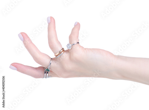 Female hand with many rings on white background isolation