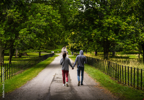 A young couple enjoys walks in Killarney National Park, near Killarney, County Kerry, Ireland