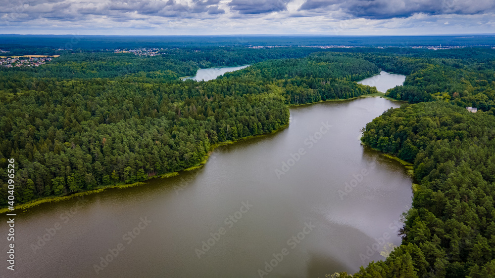 Aerial view of lake in the middle of the forest by drone Aerial view of lake in the middle of the forest by drone