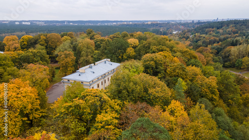 Aerial view of old manor in the middle of the forest in autumn by dorne