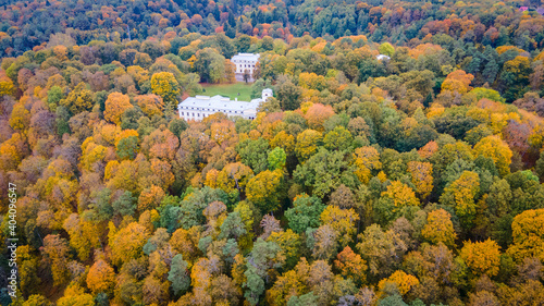 Aerial view of old manor in the middle of the forest in Verkiai national park in autumn by drone