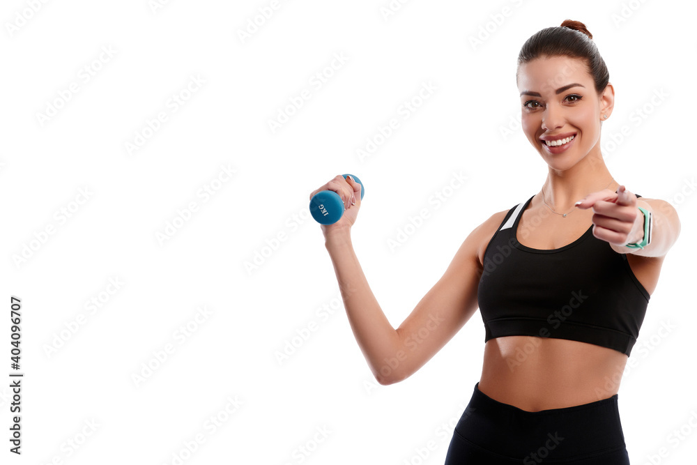 Attractive caucasian slim woman doing physical exercise using dumbbell and showing finger gesture isolated on white background Attractive caucasian slim woman doing physical exercise using dumbbell and showing finger gesture isolated on white background
