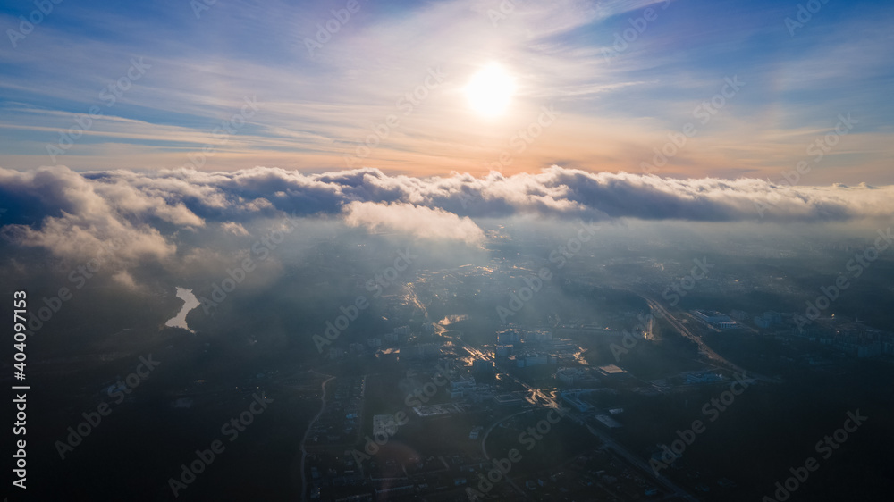 Aerial view of city from above the clouds by drone