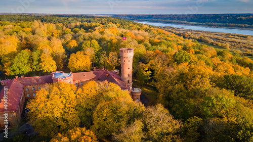 Aerial view of old red brick castle in Lithuania in autumn by drone