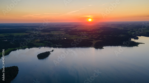 Aerial view of lake Plateliai panorama during sunset by drone