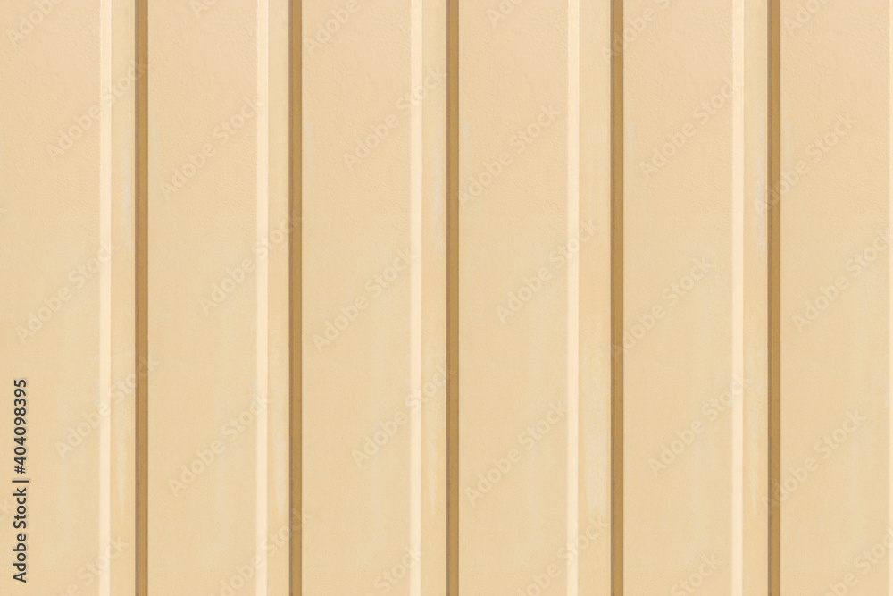 Obraz premium Texture of the wall with yellow vertical siding panels in strips