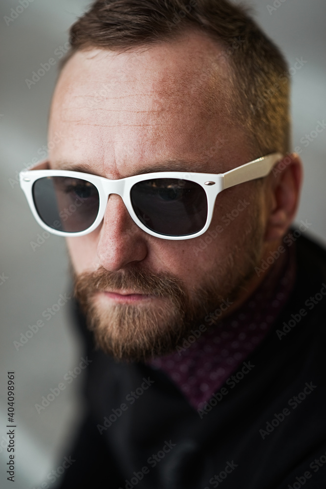 Bearded man portrait. Guy bearded in sunglasses. Close up of handsome bearded man sunglasses Bearded man portrait. Guy bearded in sunglasses. Close up of handsome bearded man sunglasses