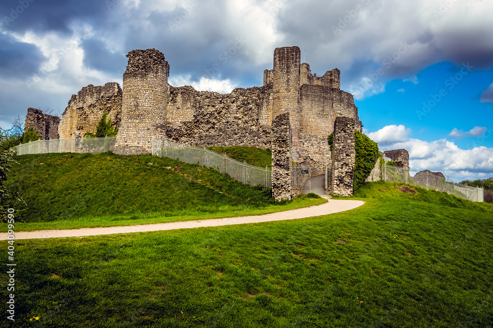 A view of the motte and ruins of the castle at Conisbrough, UK in springtime