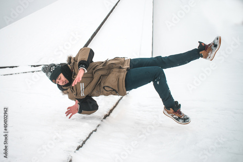 Man slipping on ice and falling down