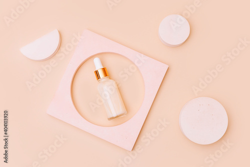 Trendy background of geometric shapes with natural cosmetic skincare cream bottle. . Product presentation. Top view photo