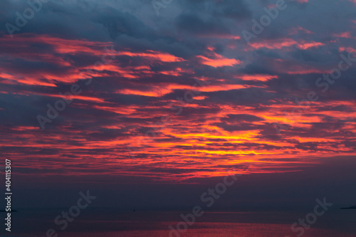 Dramatic  orange and red sunset over the sea at Scheveningen. © Robert Schütz