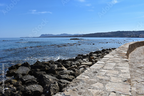 stone beach next to the pier photo