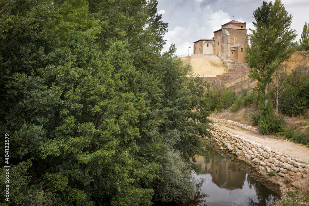 church of Nuestra Senora de Belen and the Carrion river in Carrion de los Condes, province of Palencia, Castile and Leon, Spain