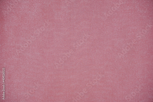 Silk fabric, shiny organza is light peach color as background.