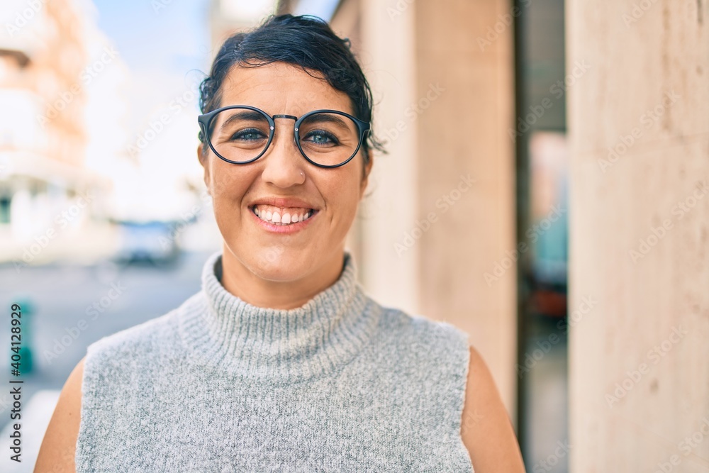 Young plus size woman smiling happy walking at the city. Young plus size woman smiling happy walking at the city.