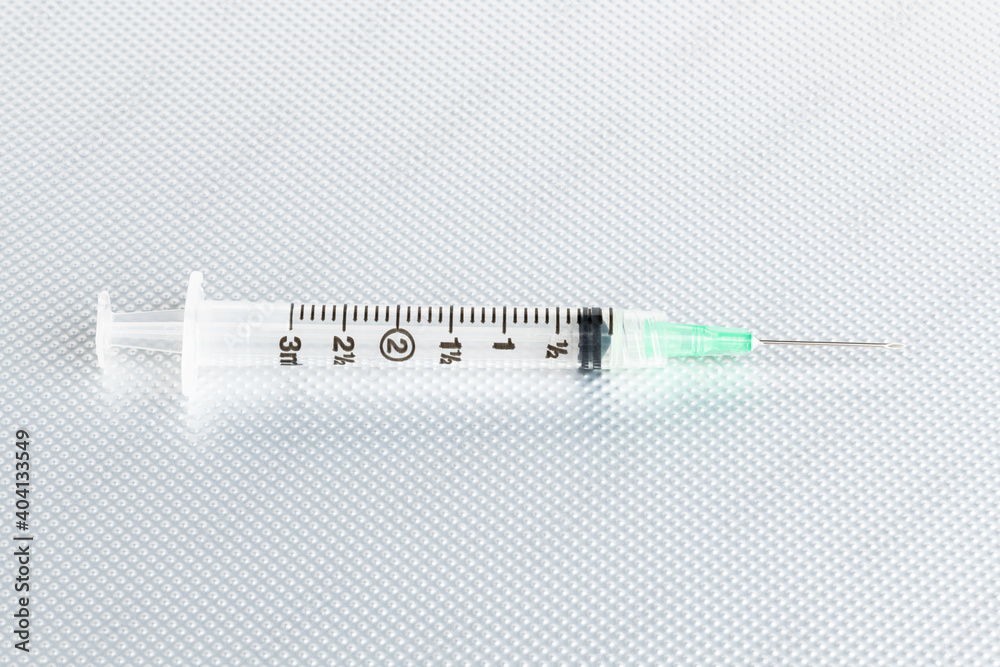 Hygienic Single-Use Disposable Injection On Metal Background Hygienic Single-Use Disposable Injection On Metal Background