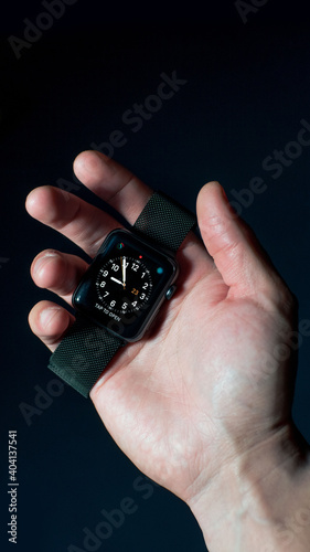hand holding smart watch
