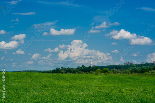 green field  pipe and blue sky in summer