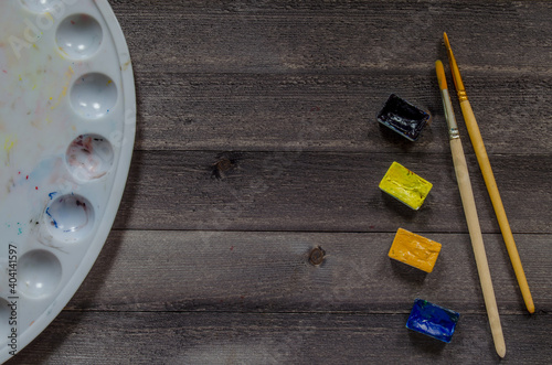 Acrylic paints on the table. Photo of art materials