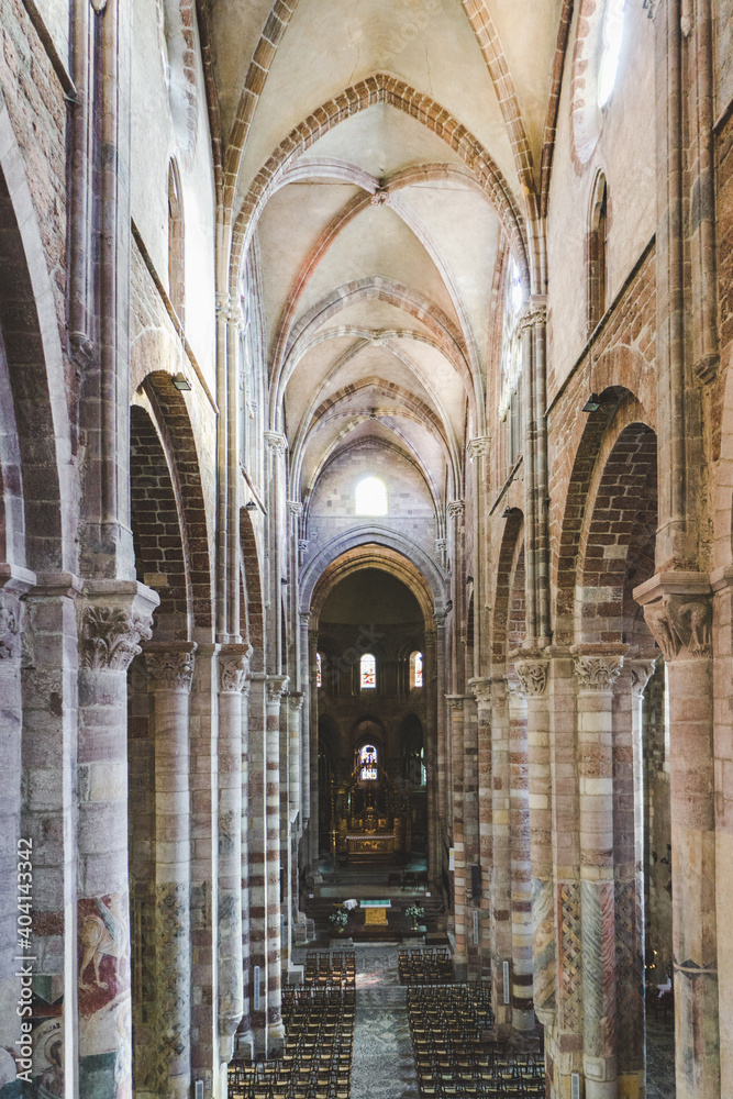 the nave, columns and vault of the romanesque St Julien basilica in Brioude, Auvergne (France)