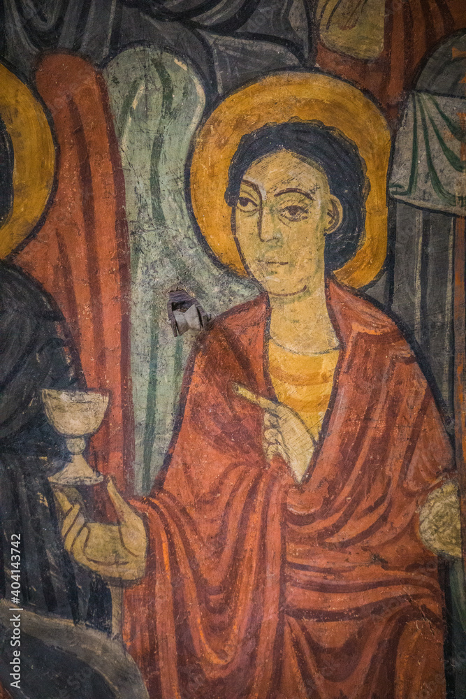 Details of religious frescos inside the romanesque St Julien Basilica in Brioude, Auvergne (France)