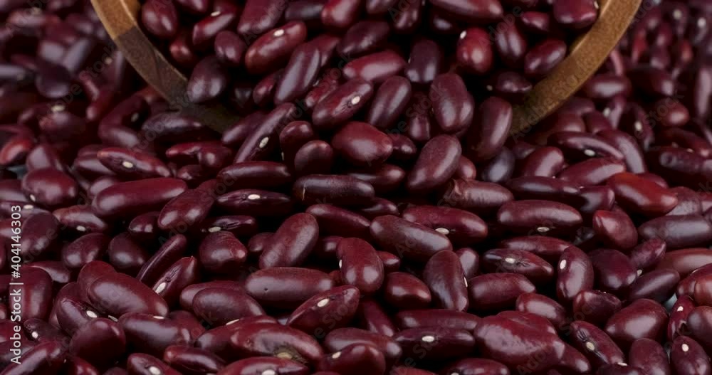 Dolly in of raw red kidney beans texture pattern with wooden for background design Dolly in of raw red kidney beans texture pattern with wooden for background design