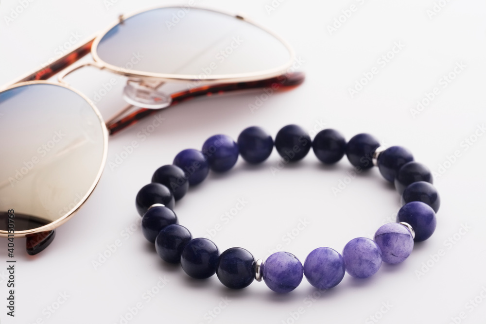 Obraz premium men's sodalite bracelet on glasses background
