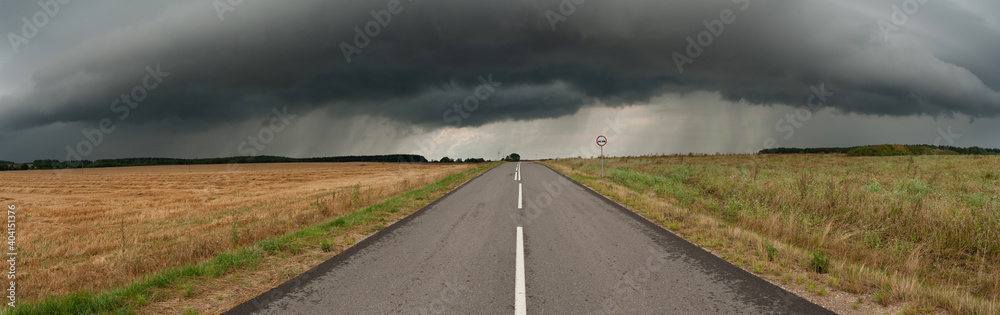 he road leading to the stormy sky