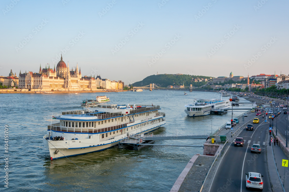 Boats on Danube river and Hungarian Parliament at sunset, Budapest, Hungary
