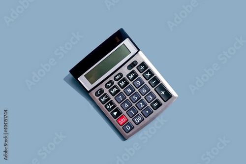 Calculator with shadow overhead view - flat lay