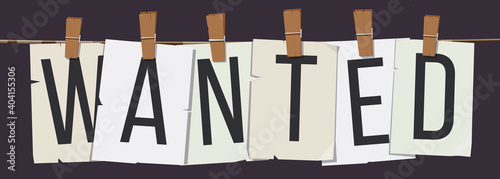 Word "Wanted" attached to the rope with hairpins