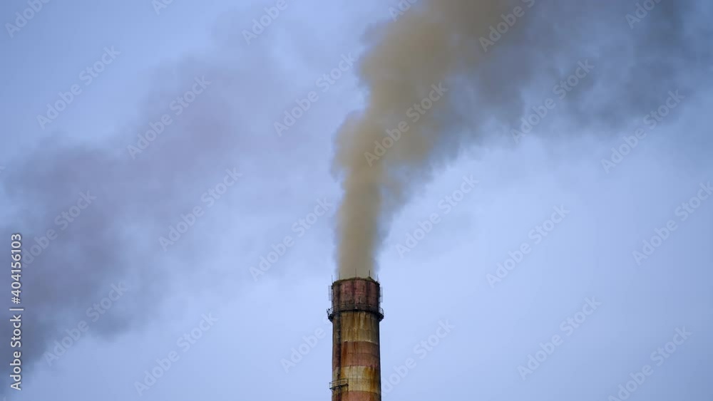 Industrial high pipe with smoke. Pollution of air with dust. Smoking pipe closeup video from a drone. Industrial high pipe with smoke. Pollution of air with dust. Smoking pipe closeup video from a drone.