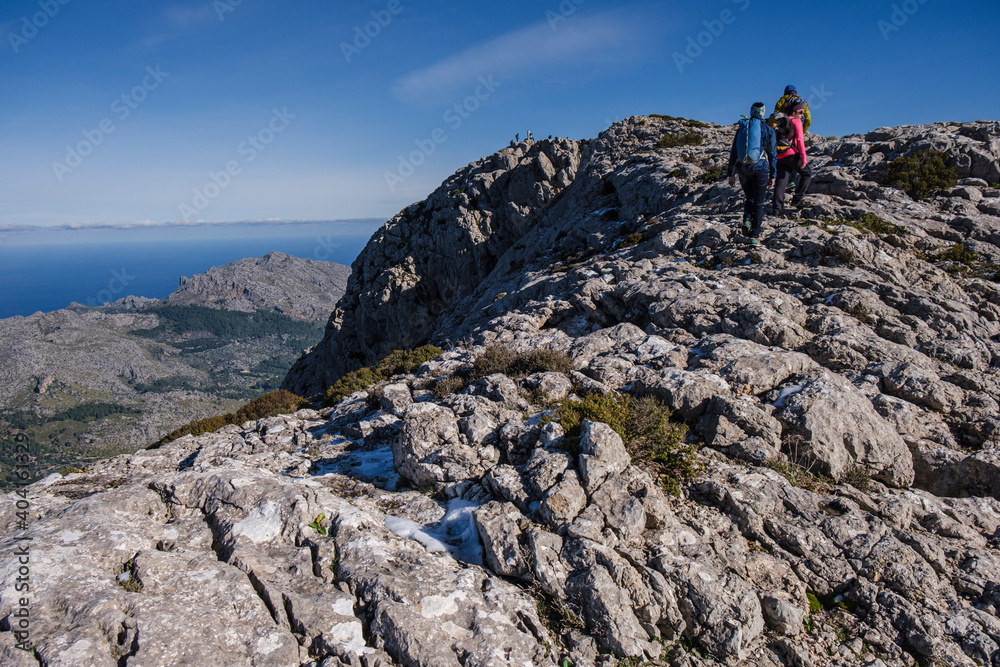 trekkers on the crest of Puig Tomir, 1103 meters, Escorca, Mallorca, Balearic Islands, Spain