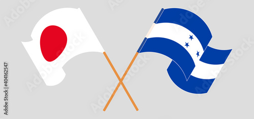 Crossed and waving flags of Japan and Honduras