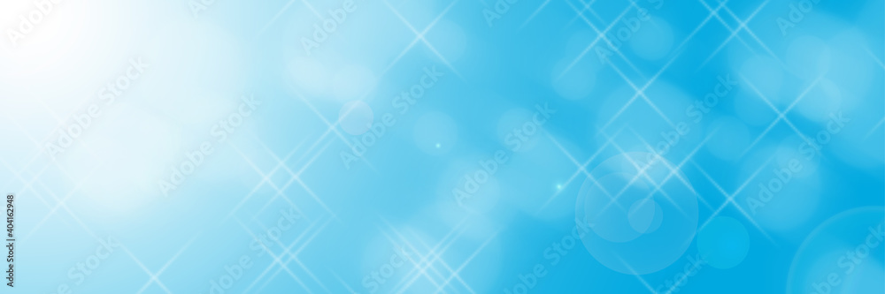 A blue photographic background with a side effect and sun rays in a panoramic frame and sparkling stars. Modern style. A flash of stars. A blue photographic background with a side effect and sun rays in a panoramic frame and sparkling stars. Modern style. A flash of stars.