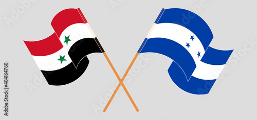 Crossed and waving flags of Syria and Honduras