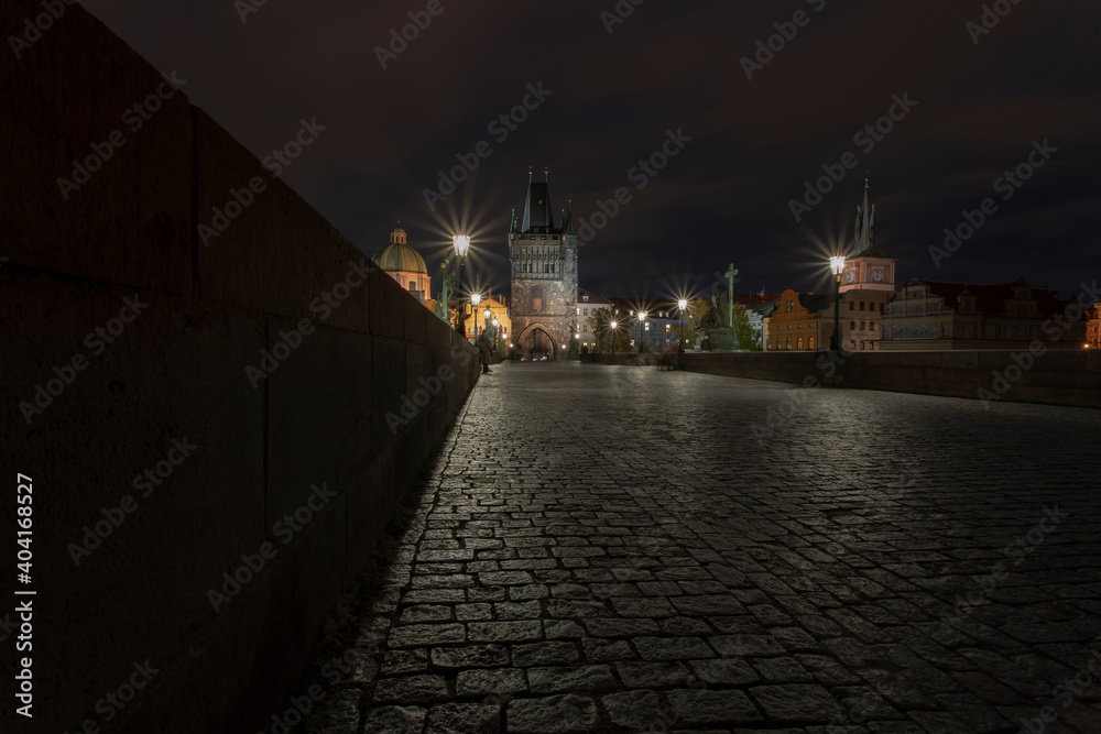 .cobblestones and street lights on Charles Bridge at night in the Czech Republic